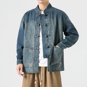 Person wearing a japanese denim jacket with button details on a white background