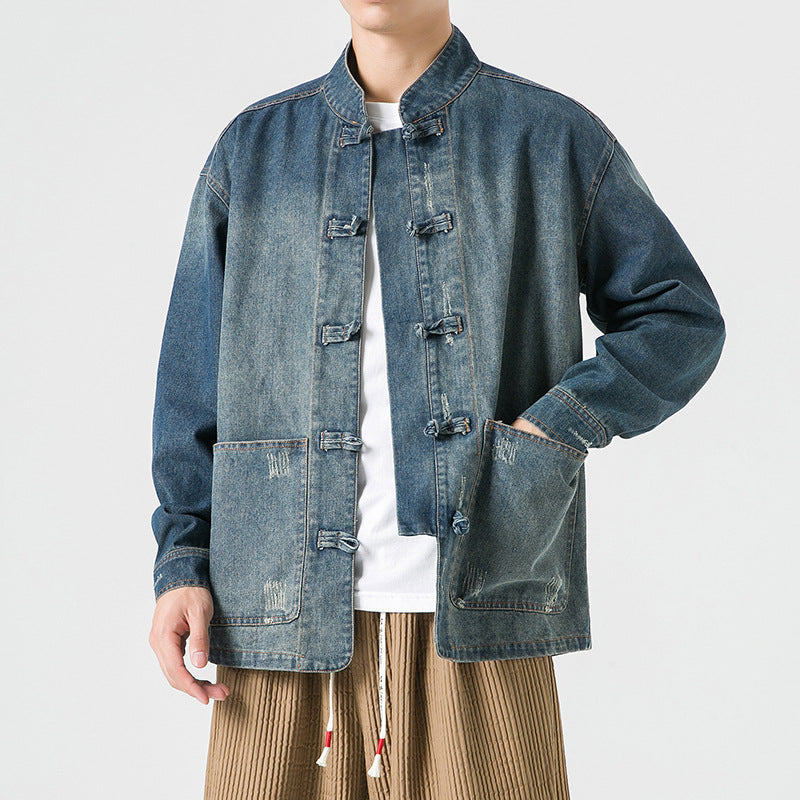 Person wearing a japanese denim jacket with button details on a white background