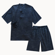 Navy blue pajama set with shirt and shorts on a white background