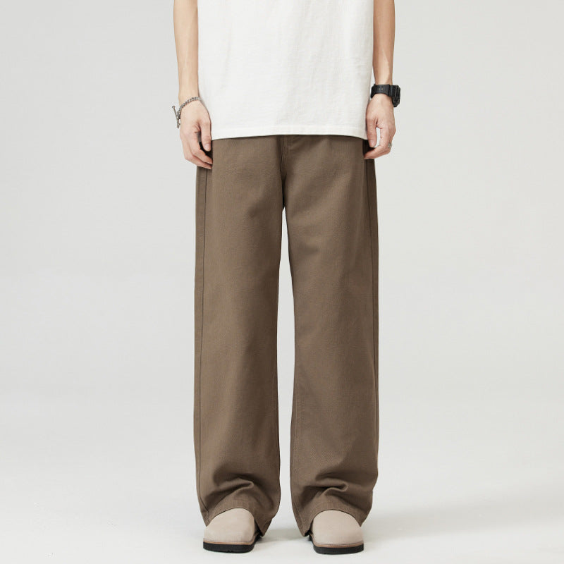 Person wearing brown wide-leg  Japanese Chino Pants on a white background