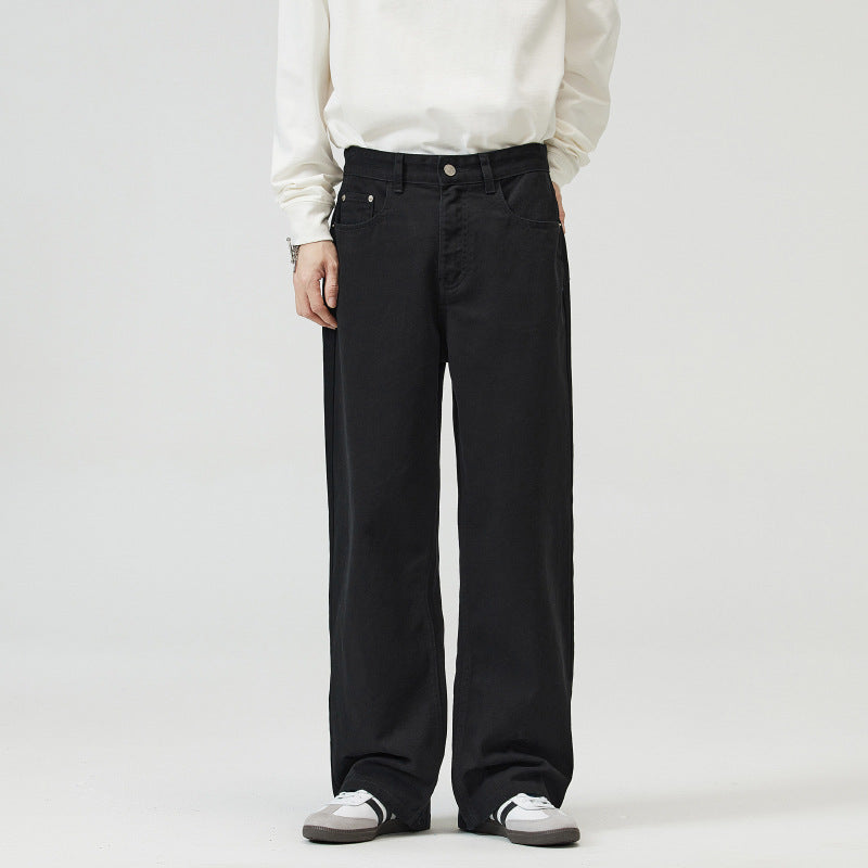 Person wearing black Wide-Leg Japanese Chino Pants and a white sweater on a plain background