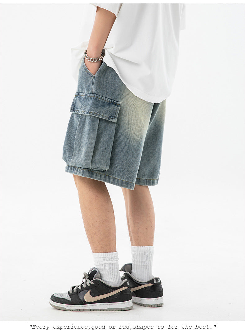Person wearing light blue cargo shorts and black sneakers on a white background