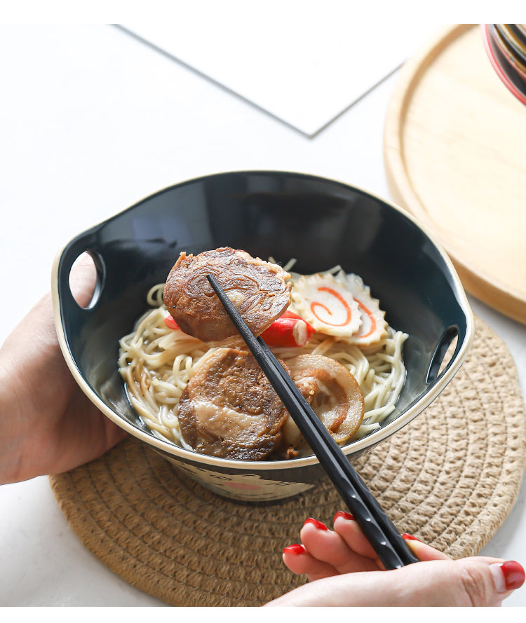 ramen bowl with chopstick holder with food